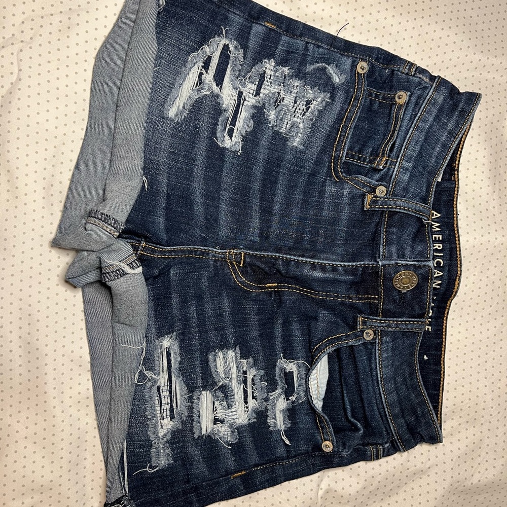 size 2 american eagle dark washed ripped and repaired jean shorts